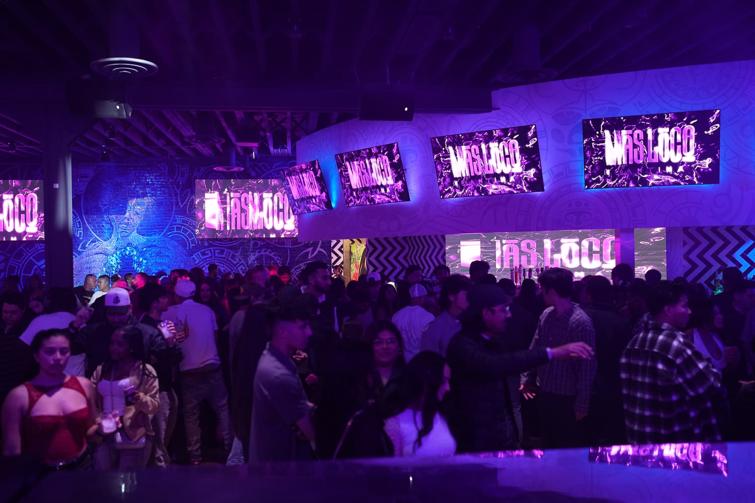 Guests celebrating with a toast at El Cabron event